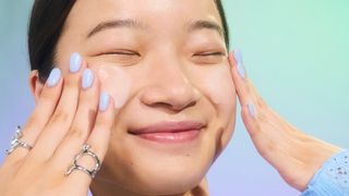 A person using the Bubble Soft Launch Hydrating Creamy Cleanser one of Teen Vogue's picks for the Best Face Washes and...