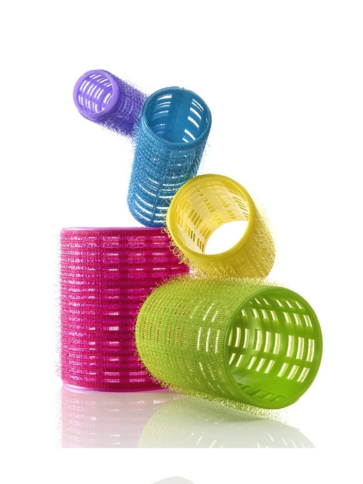 Five Conair SelfGrip Rollers in different colors and sizes on white background