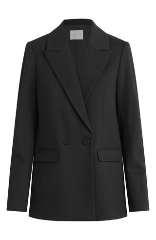 Image may contain Blazer Clothing Coat Jacket Formal Wear Suit and Tuxedo