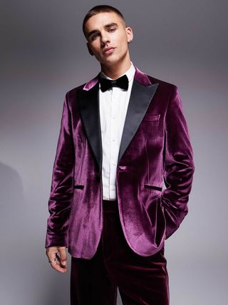 Image may contain Clothing Formal Wear Suit Tuxedo Velvet Adult Person Accessories and Tie