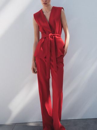 Image may contain Clothing Dress Formal Wear Fashion Person Velvet and Suit