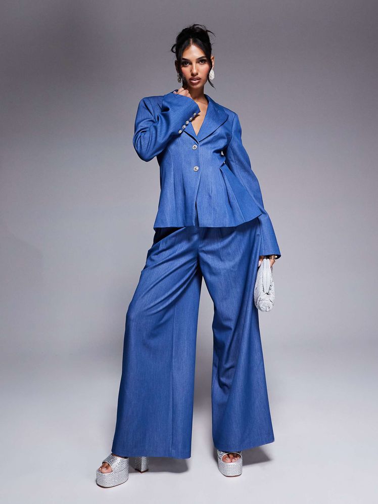 Image may contain: Clothing, Formal Wear, Suit, Pants, Coat, Pajamas, Adult, and Person