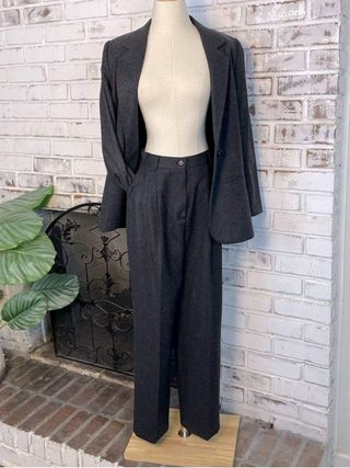 Image may contain Clothing Formal Wear Suit Pants Coat Mannequin and Sleeve