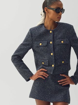 Image may contain Blazer Clothing Coat Jacket Adult Person Long Sleeve Sleeve Accessories and Glasses