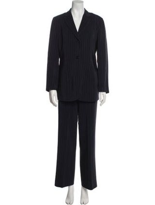Image may contain Clothing Formal Wear Suit Tuxedo Coat and Pants